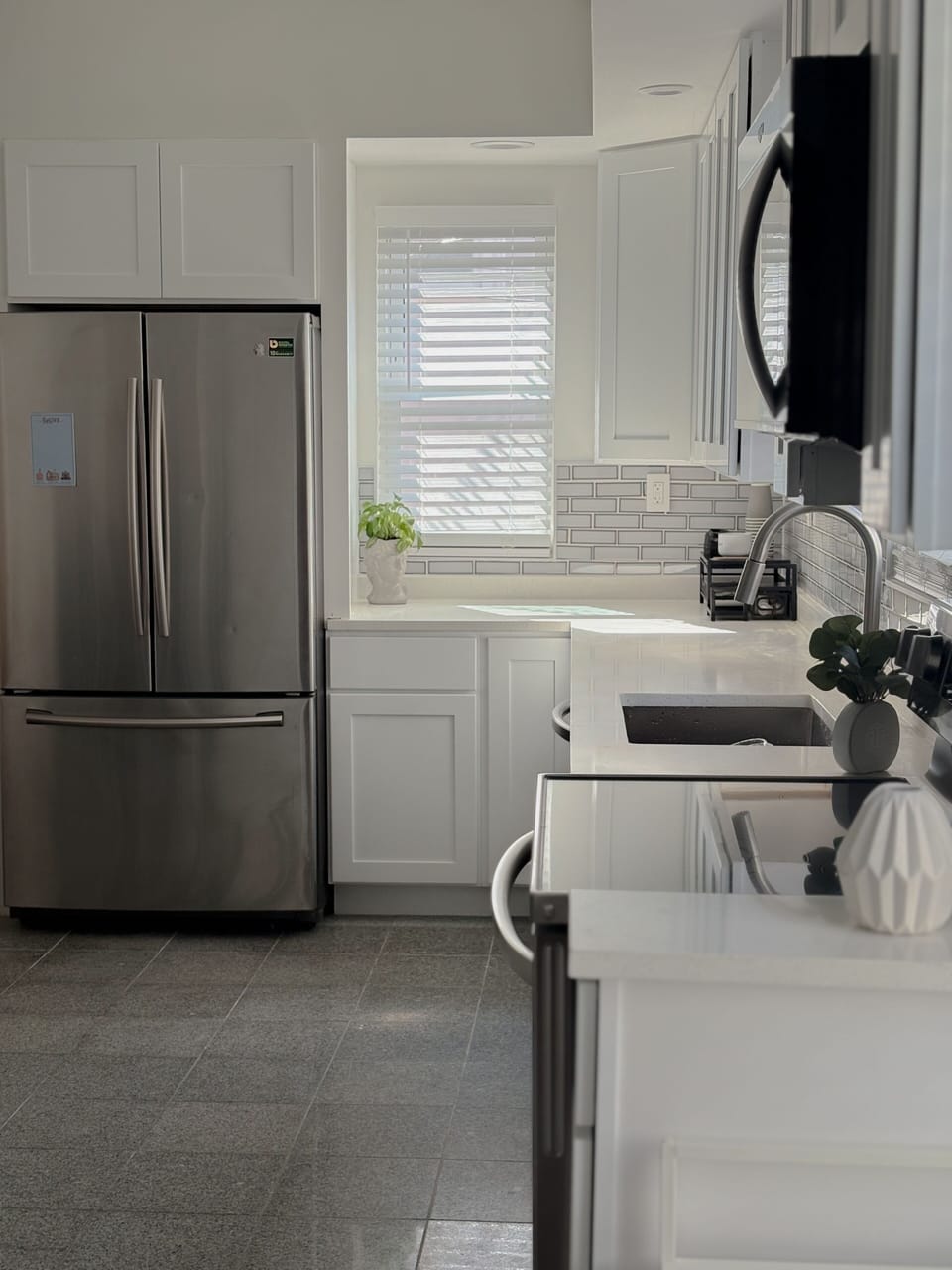 The kitchen is fully equipped and furnished with all major appliances