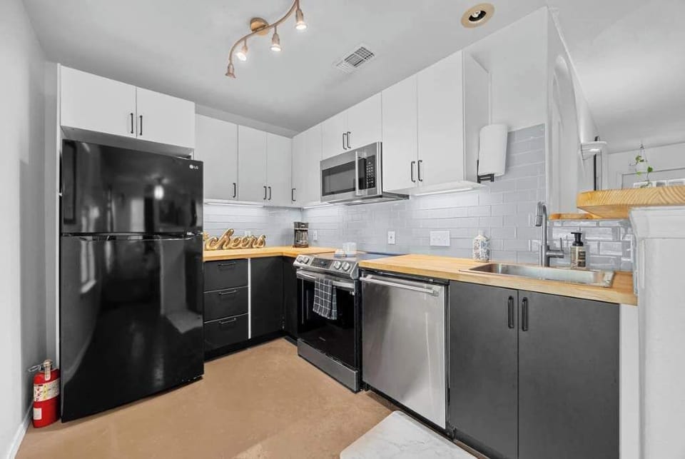 The kitchen is a perfect blend of modern functionality and cozy charm, where every detail is designed to feel both stylish and inviting. 