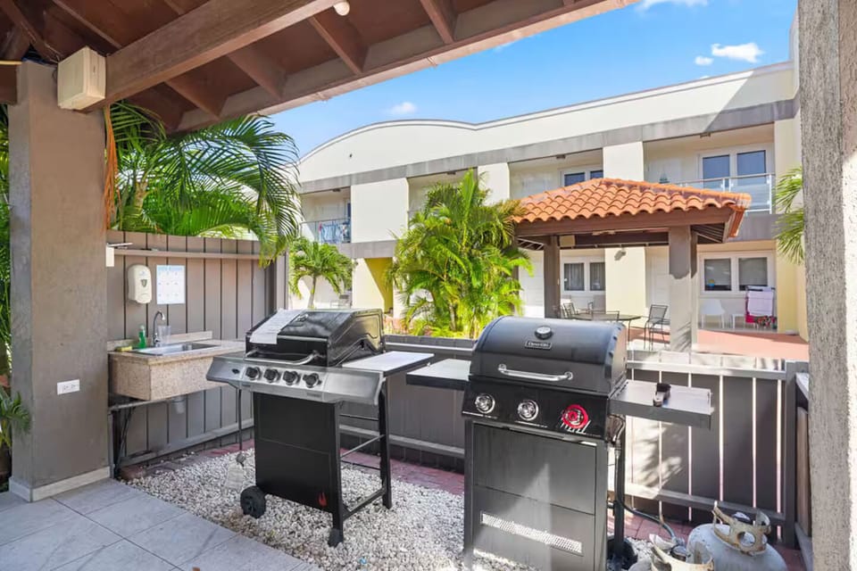 Fire up the grill and enjoy a cookout under the sun with this fully equipped BBQ area, perfect for laid-back evenings and flavorful meals