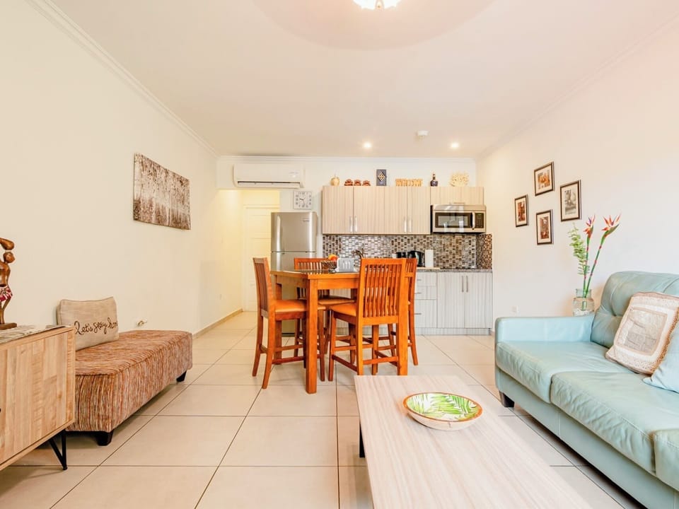 Enjoy home-cooked meals in this stylish dining space with seating for four, conveniently located next to a fully equipped kitchen.