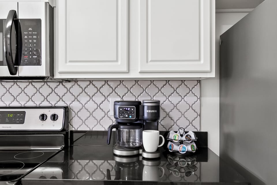 Kitchen Keurig with K-cup and Coffee Pot