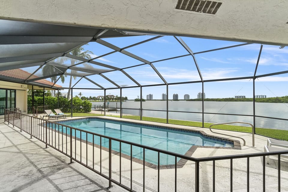 Refresh in your private screened pool overlooking the tranquil bay.