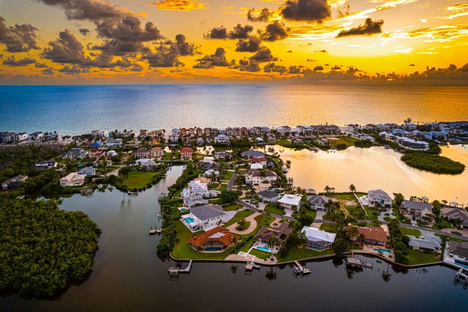Sunset skies light up your waterfront neighborhood—magical evenings.