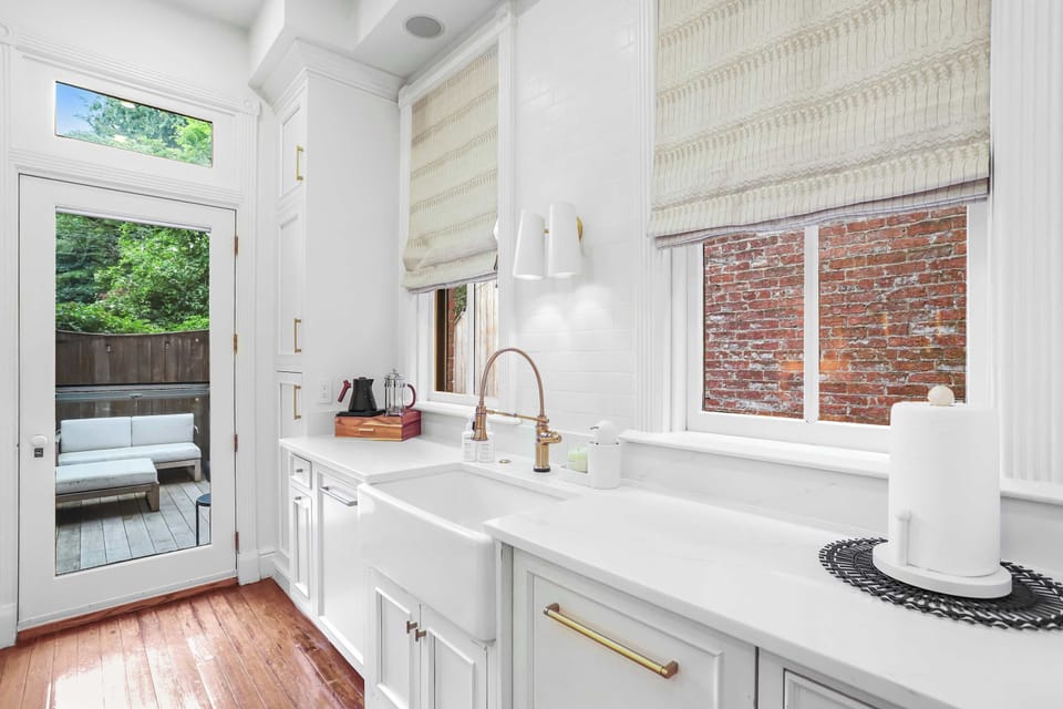 Kitchen with a view of the door to the back patio. 