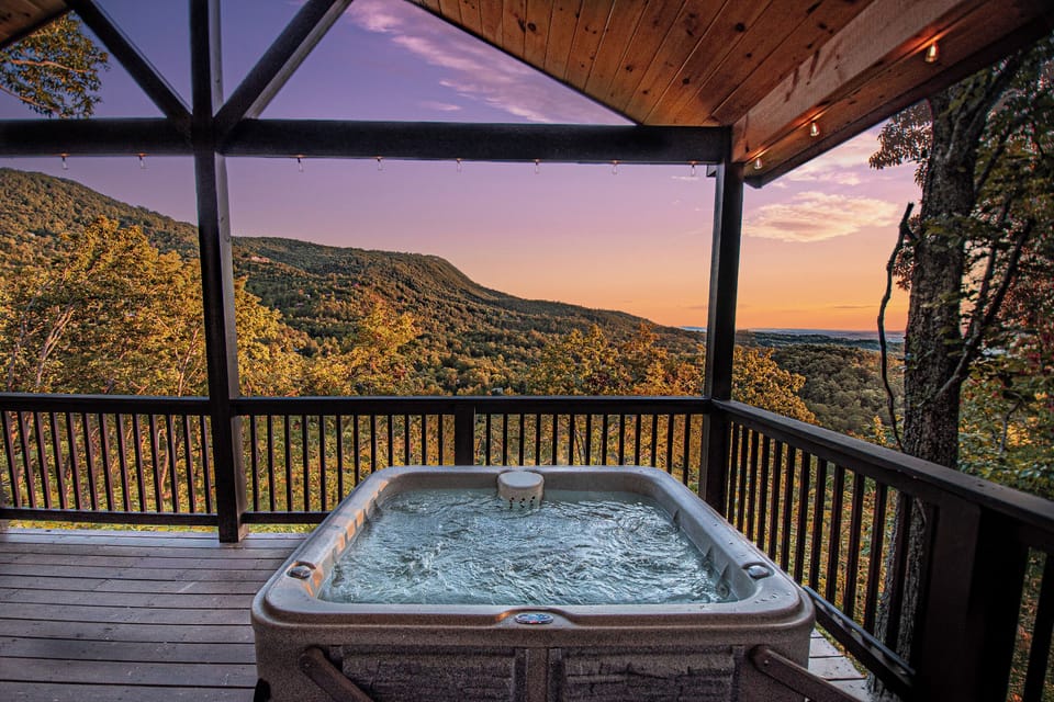 ROMANCE awaits at this unique and private true log cabin in the Smokies. The views, amenities and sunrises will take your breath away!!