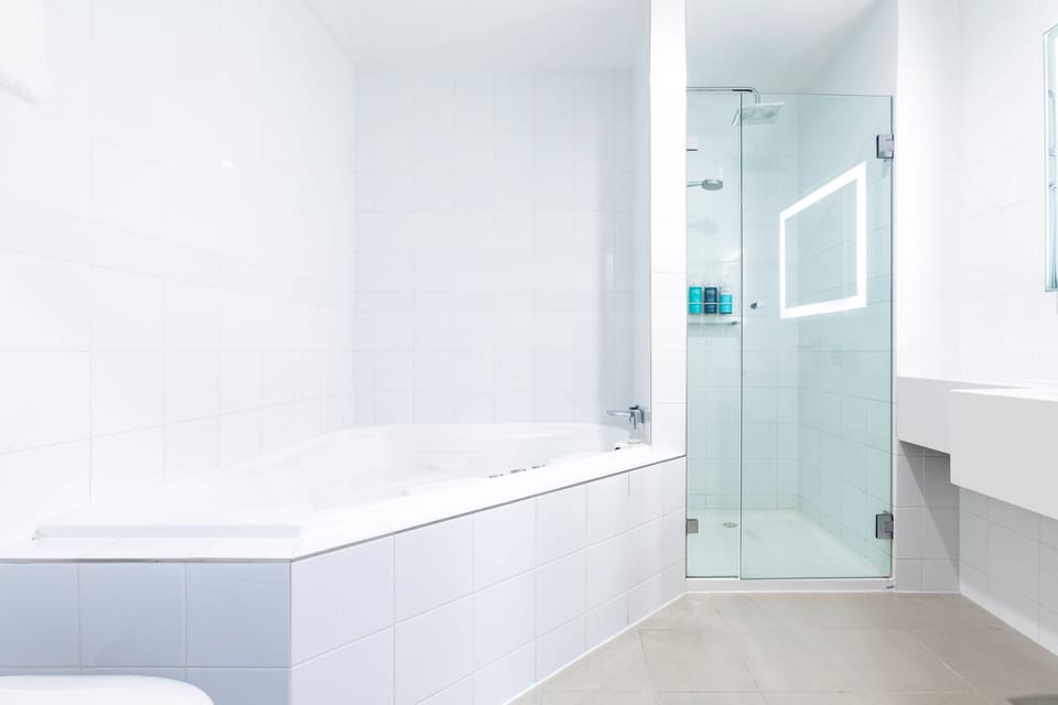Suite, 1 King Bed with Sofa bed | Bathroom | Eco-friendly toiletries, hair dryer, towels, soap