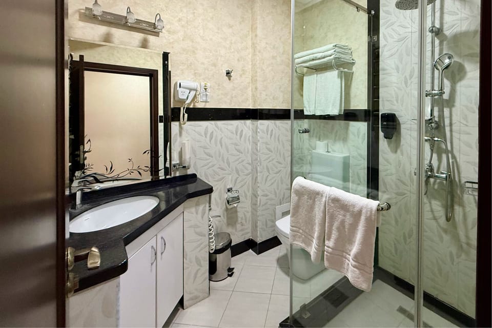 Shower, free toiletries, hair dryer, slippers