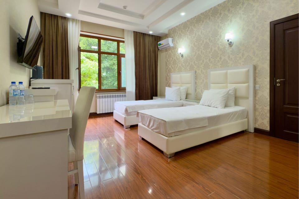 Standard Quadruple Room, Garden View | Desk, laptop workspace, WiFi (free)