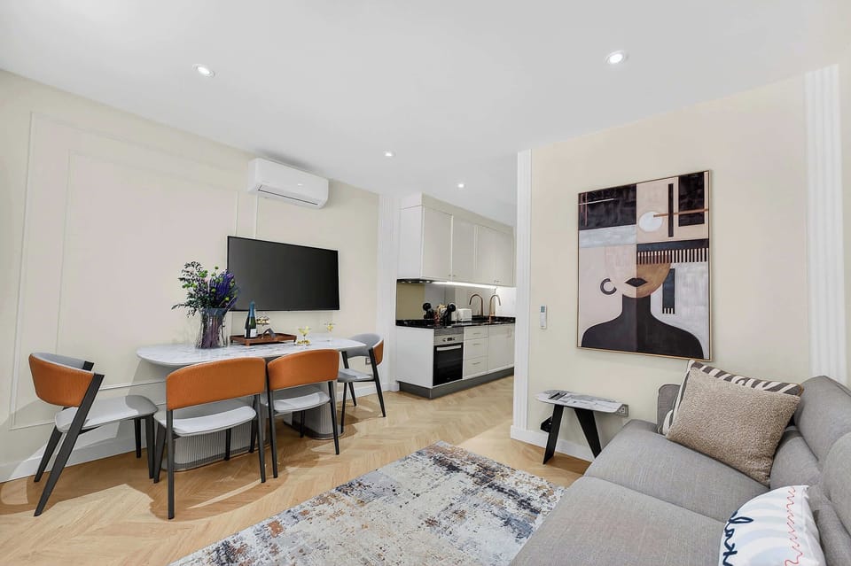 Elegant Open-Concept Living and Dining Area — Relax in Contemporary Comfort with a Designer Sofa, Smart TV and Ocean Breeze Ambience