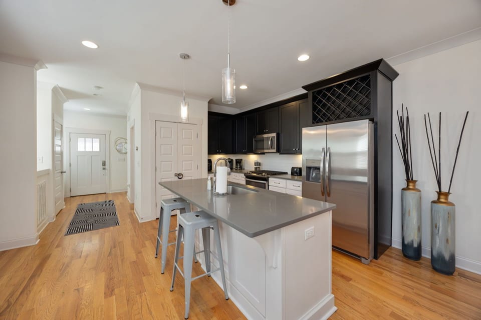 Modern kitchen with stainless appliances.
