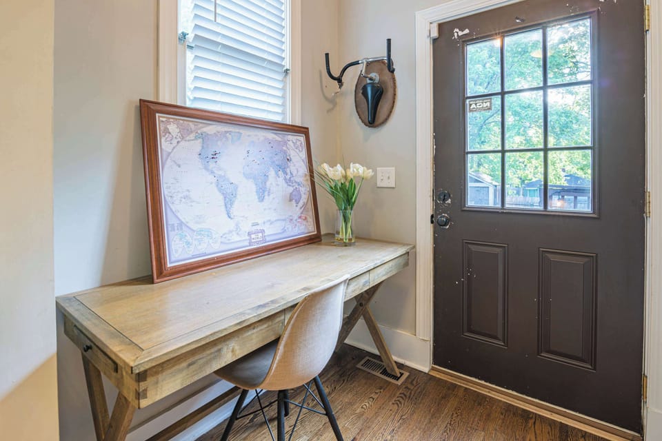 Bright and inviting space with a stylish desk and floral accents, perfect for planning adventures!