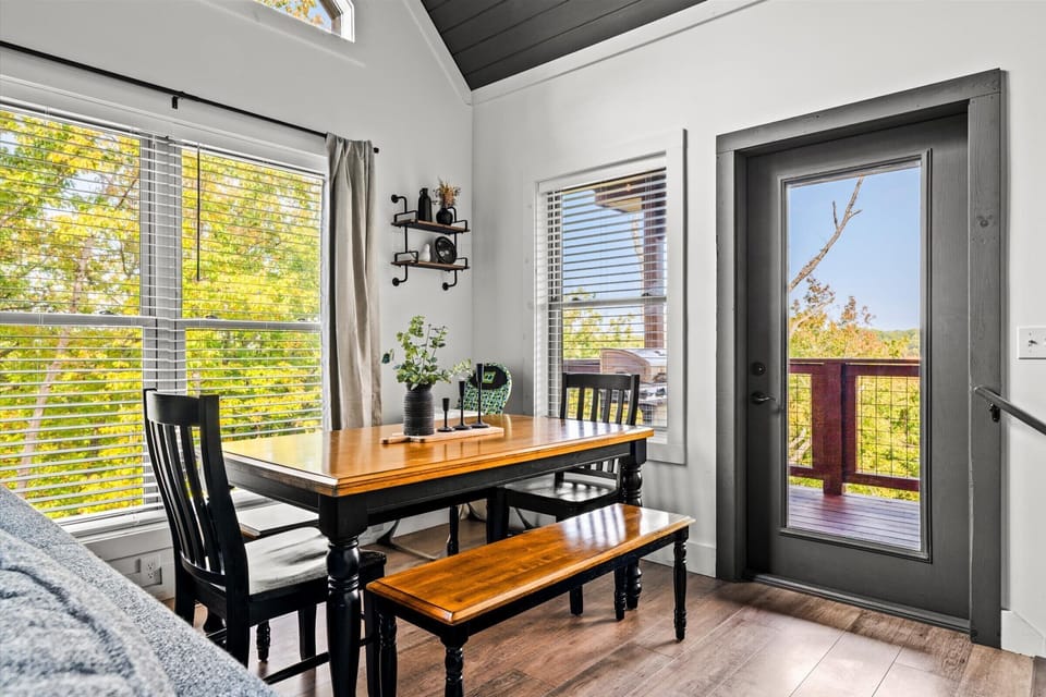 Enjoy intimate meals at the cozy dining nook with stunning mountain views framed by large windows. 