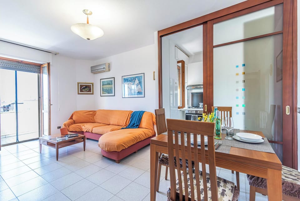 Family Apartment, Multiple Bedrooms (Casa Gialla) | Living area | 21-inch TV with cable channels