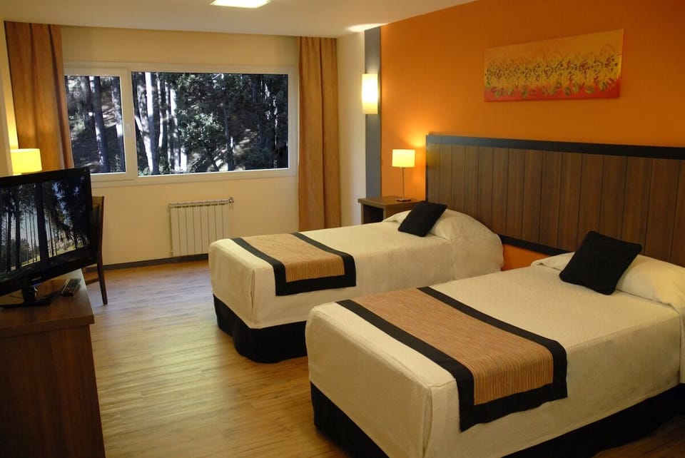 Settle into bright twin beds after a day exploring.