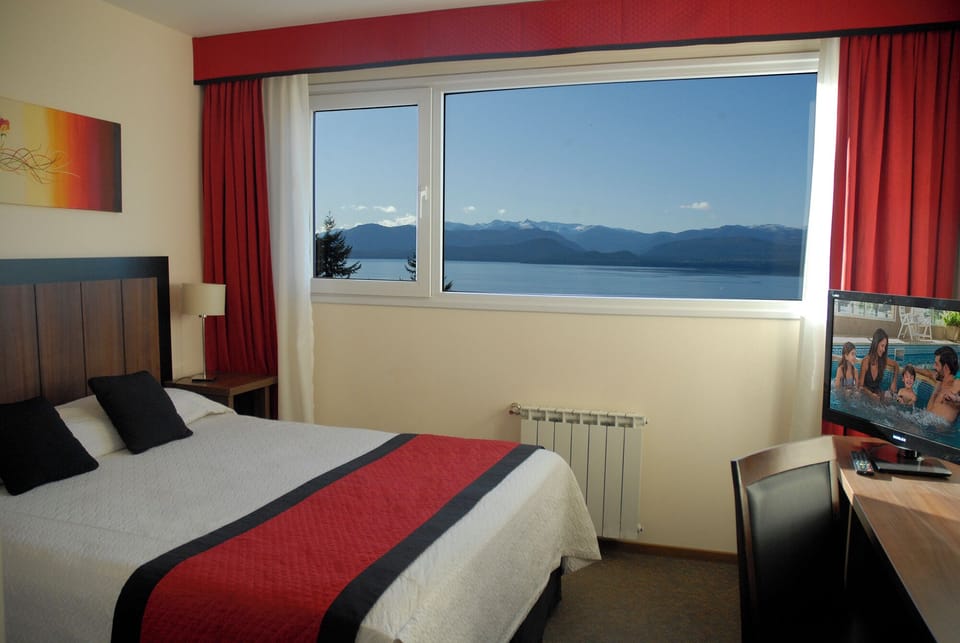 Wake up to breathtaking lake views from your plush bed.