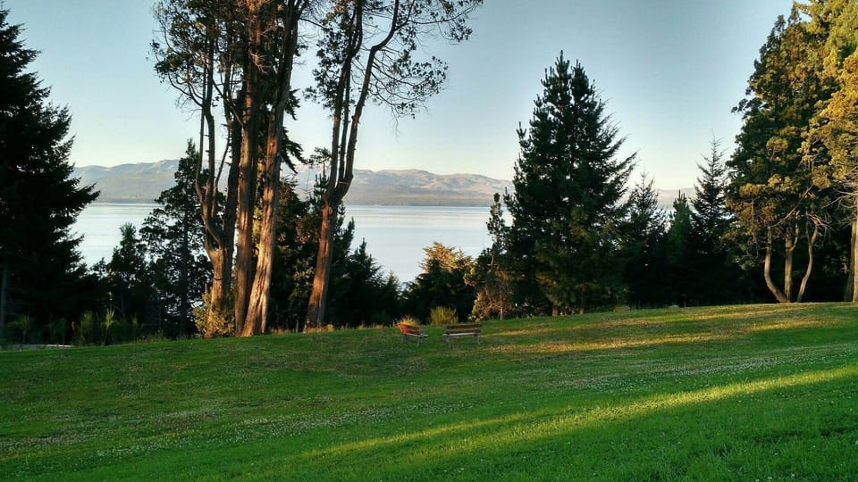 Unwind on the expansive lawn facing tranquil waters.