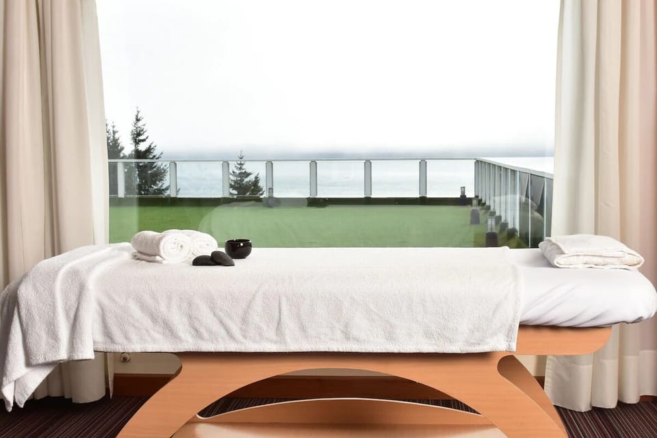Indulge in soothing treatments with calming views beyond curtains.
