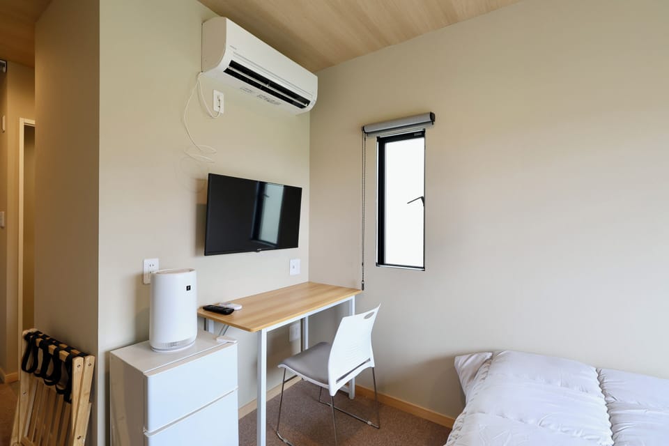 Desk, laptop workspace, blackout drapes, soundproofing