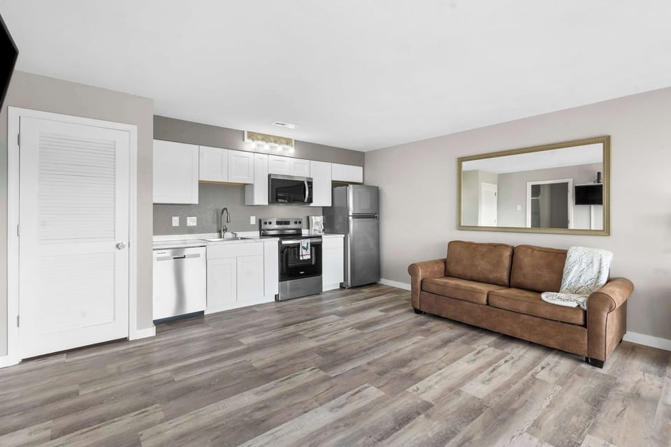 The sleek, open kitchen offers ample space & every home comfort​