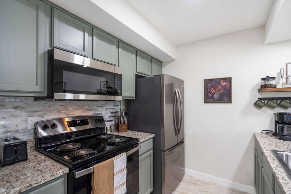 The open kitchen offers ample space & all the comforts of home​