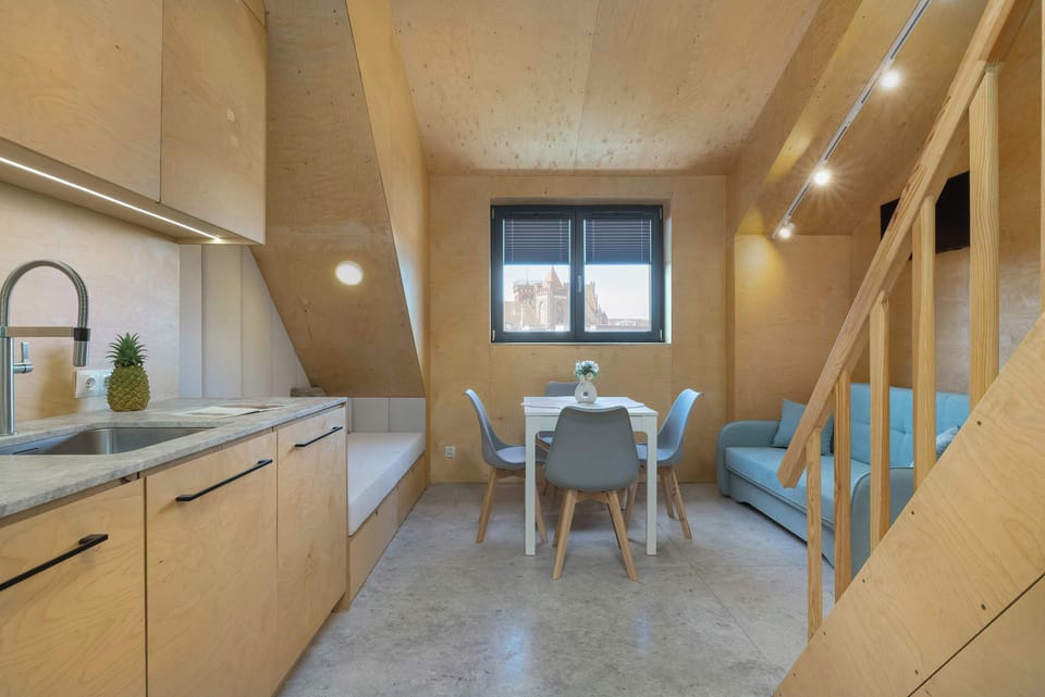 Bright kitchen with cooking utensils. 