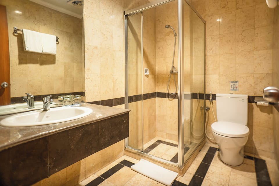 Shower, free toiletries, hair dryer, slippers