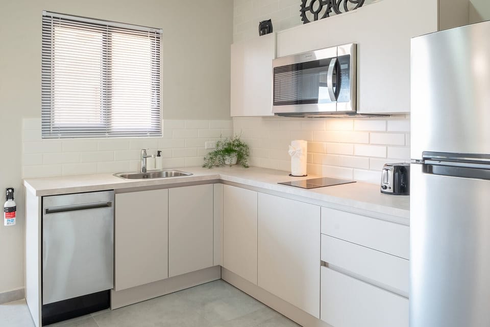 Inviting white kitchen ready for your use.
