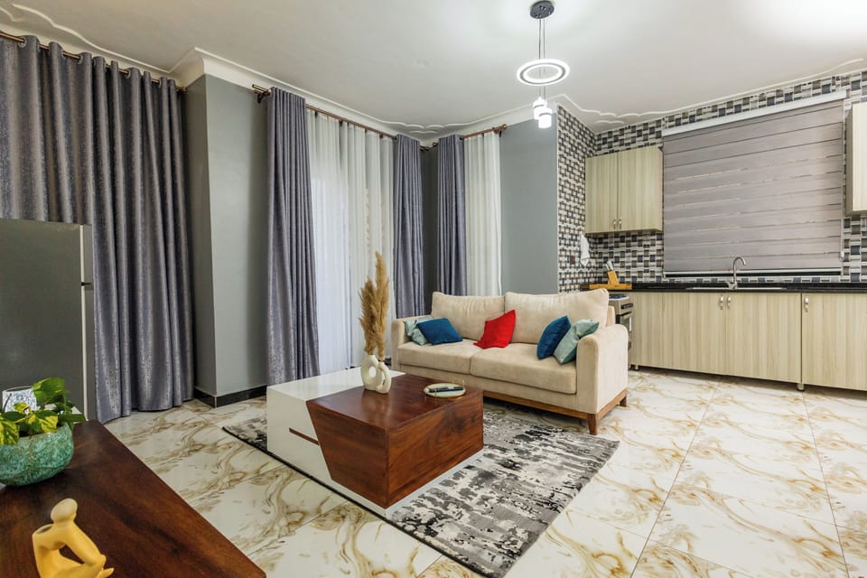 Comfort Apartment, City View | Living area | 58-inch Smart TV with cable channels
