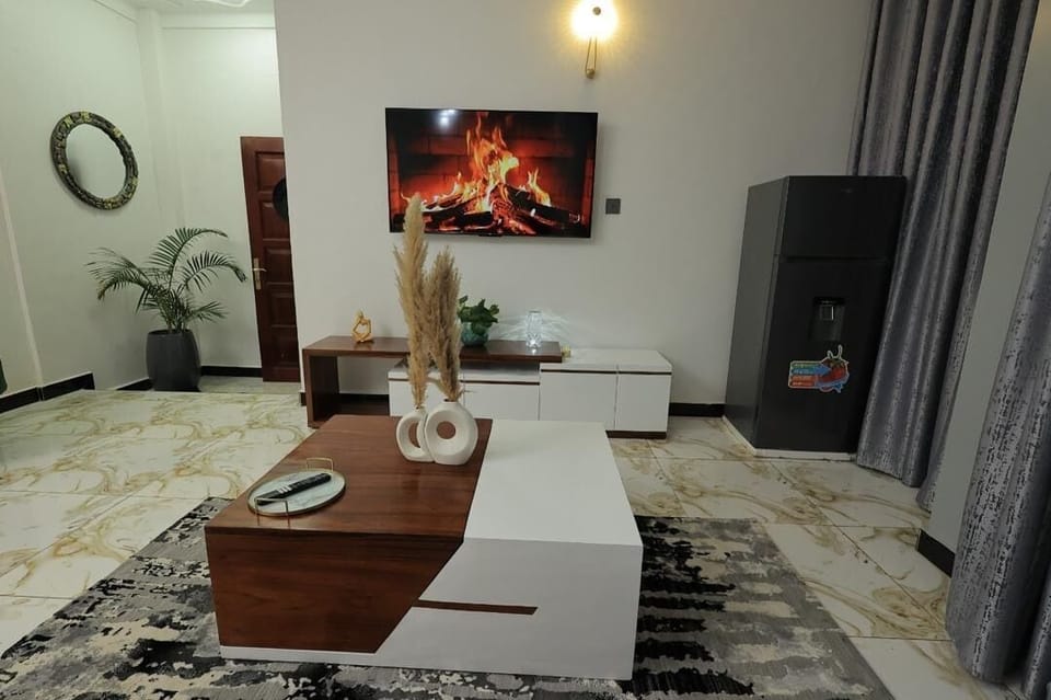 Comfort Apartment, City View | Living area | 58-inch Smart TV with cable channels