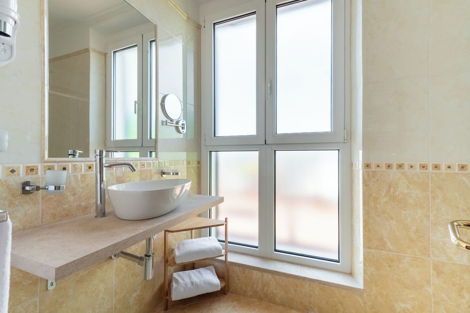 Suite, Balcony, City View | Bathroom | Hair dryer, bidet, towels, soap