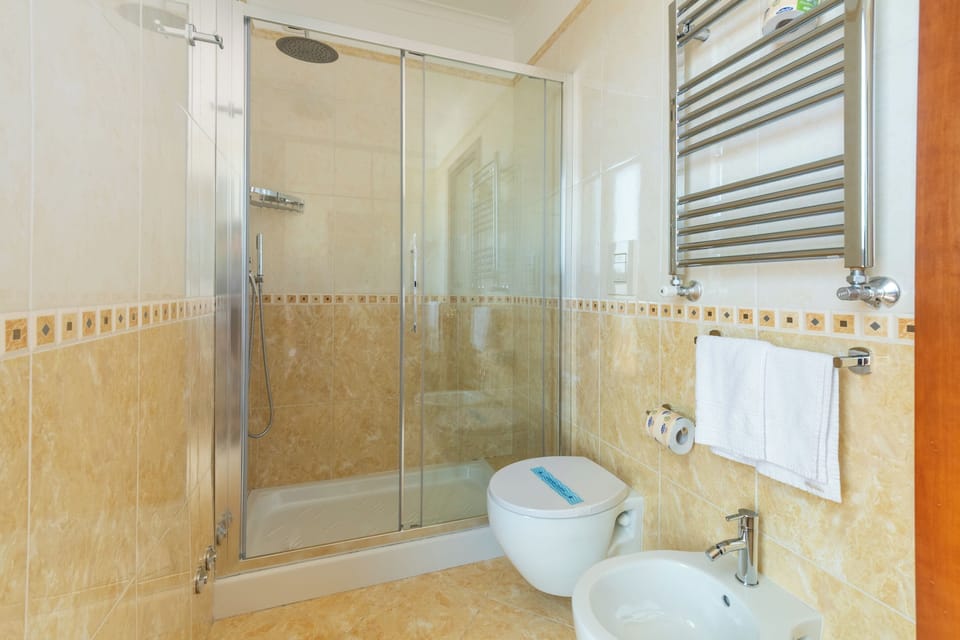 Standard Suite | Bathroom | Hair dryer, bidet, towels, soap
