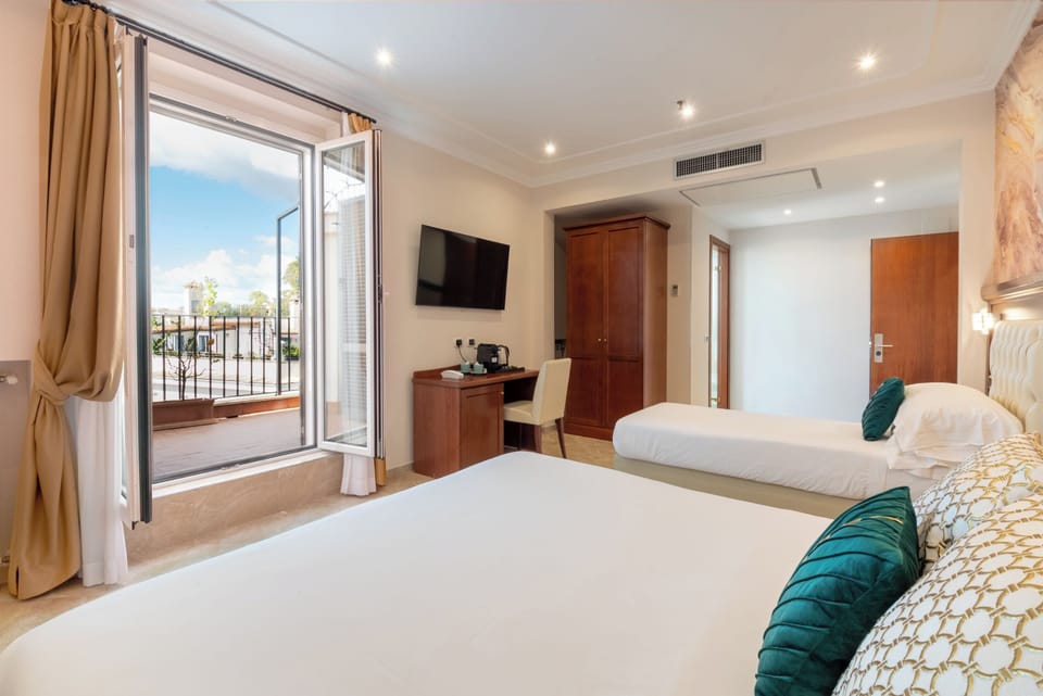Suite, Balcony, City View | In-room safe, desk, laptop workspace, soundproofing