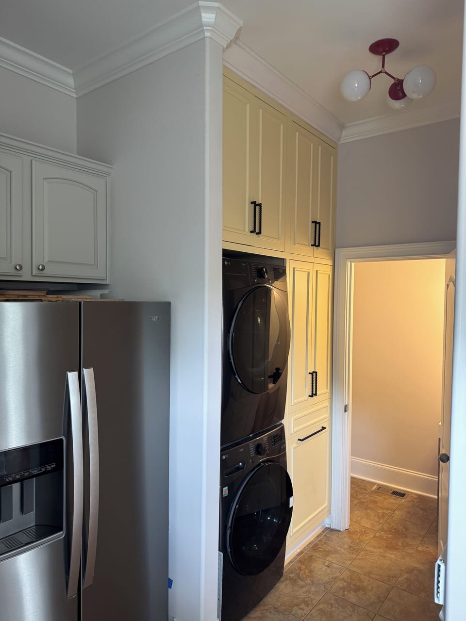 New washer/dryer with custom cabinets made by a master carpenter.