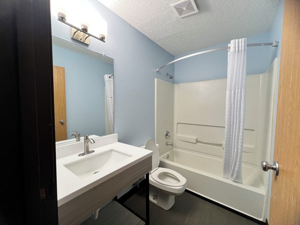 Combined shower/tub, hair dryer, towels, soap