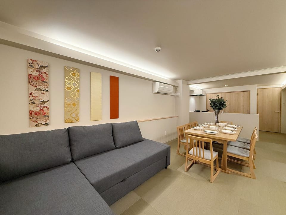 Family Apartment | Living area | 55-inch Smart TV with cable channels