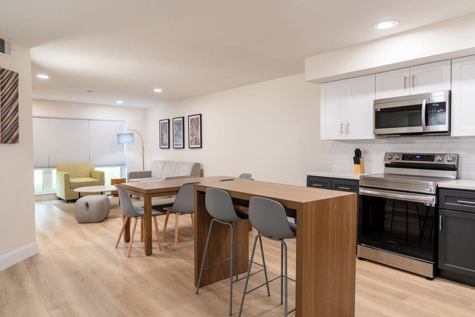 Cook with ease in a sleek kitchen with island seating.