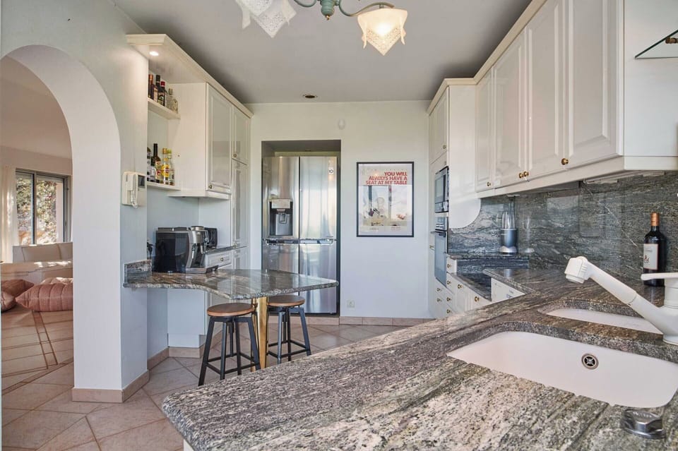 Villa | Private kitchen | Fridge, microwave, oven, stovetop