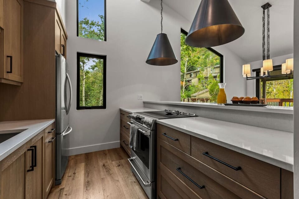 Enjoy the modern chefs kitchen and custom round table for 7