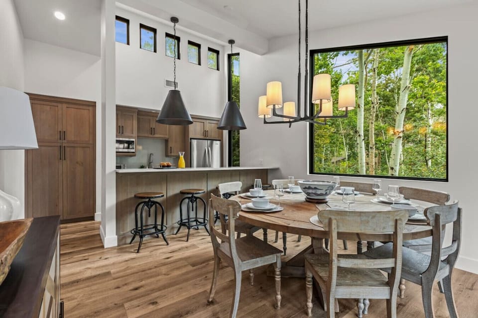 Enjoy the modern chefs kitchen and custom round table for 7