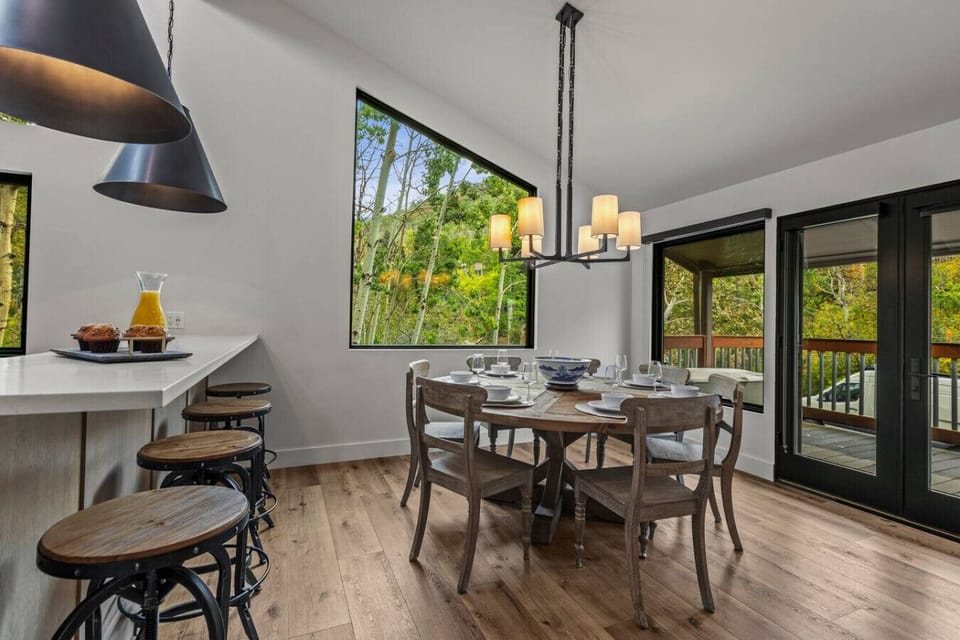 Enjoy the modern chefs kitchen and custom round table for 7