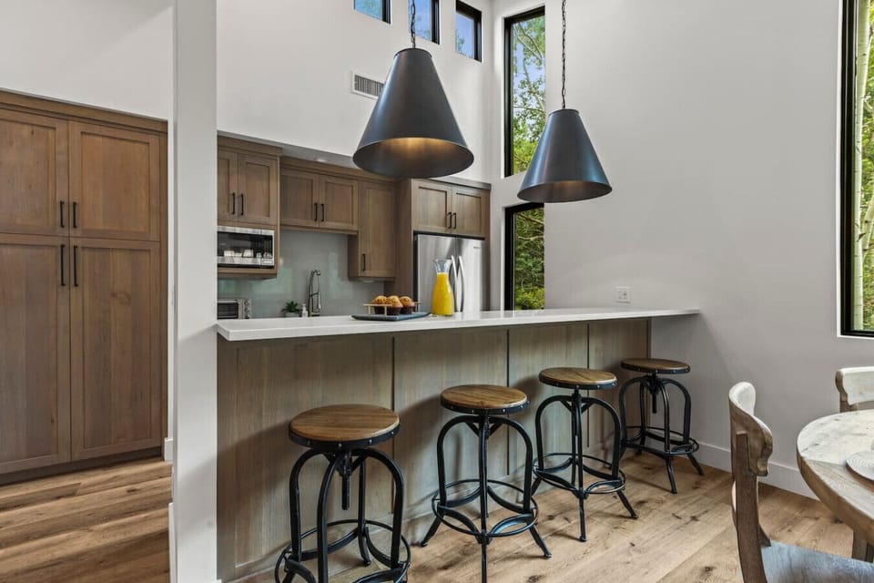 Enjoy the modern chefs kitchen and custom round table for 7