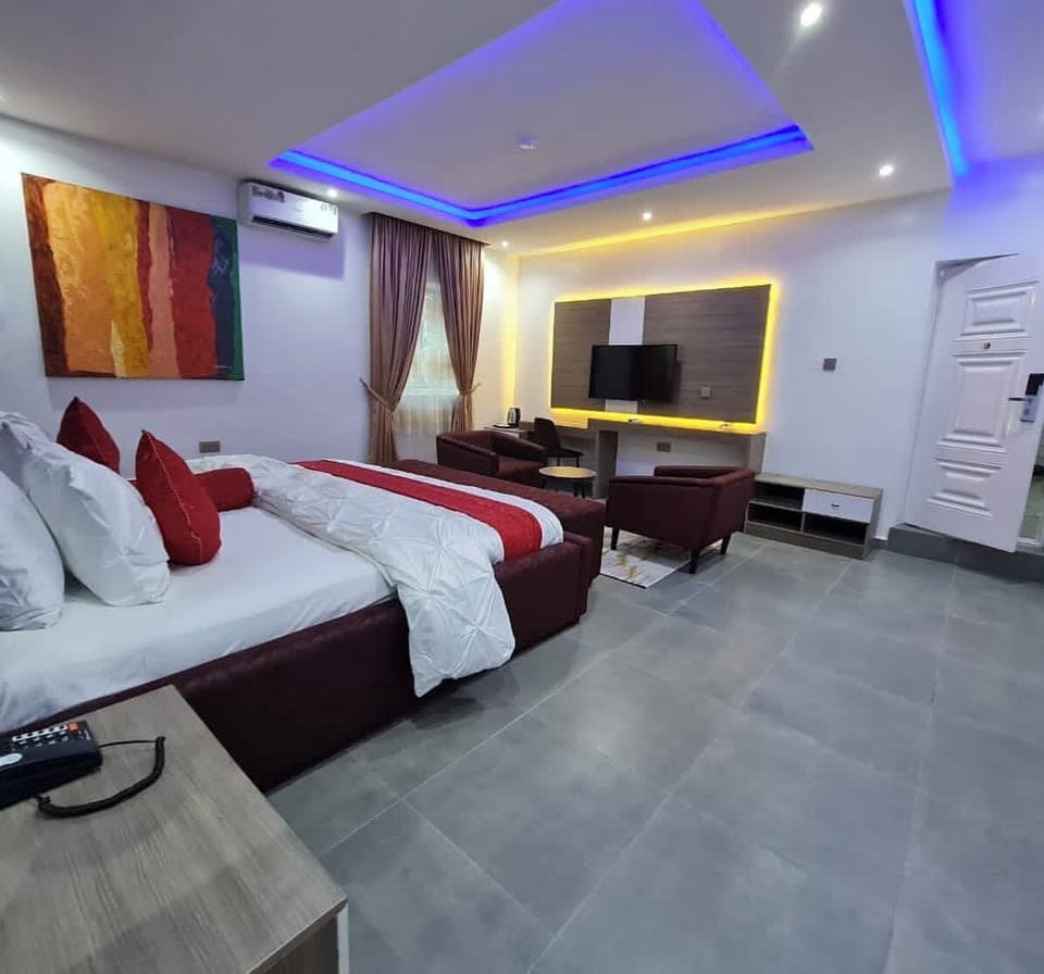 Deluxe Apartment, Balcony, City View | In-room safe, desk, laptop workspace, blackout drapes