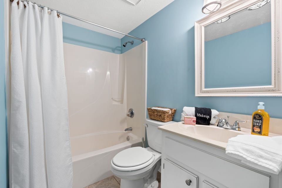 A large vanity provides ample counter space and storage, making it easy to unpack and settle in.
