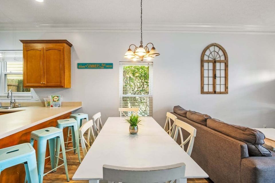Welcoming dining area with a table, providing seamless access to the kitchen!