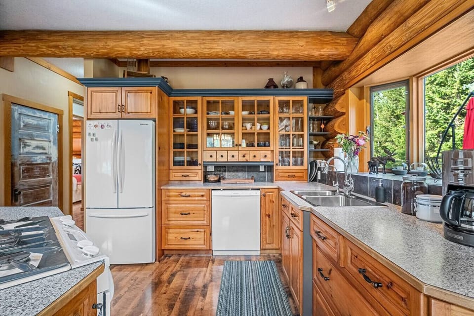 Full kitchen with a drip coffee maker, Nespresso machine, blender, crockpot, and basic condiments (sugar, coffee, tea, ketchup, mustard & relish.)