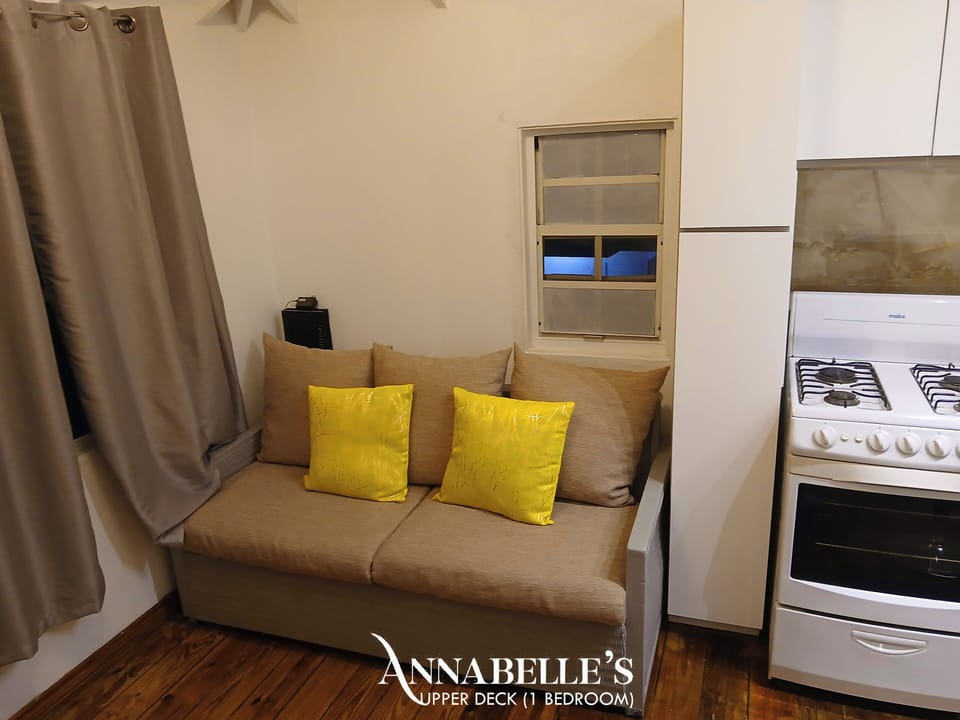 Apartment, 1 Bedroom, Balcony, Beach View | Living area | 32-inch Smart TV with digital channels, TV, books