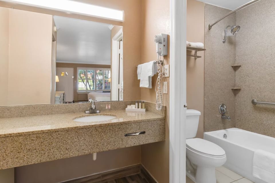 Refresh easily with bright vanity lighting and shower-tub combo.