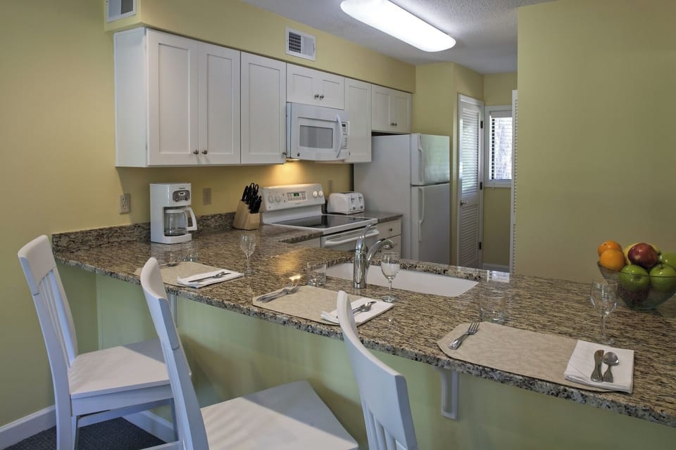 Start mornings with coffee at the spacious granite breakfast bar.