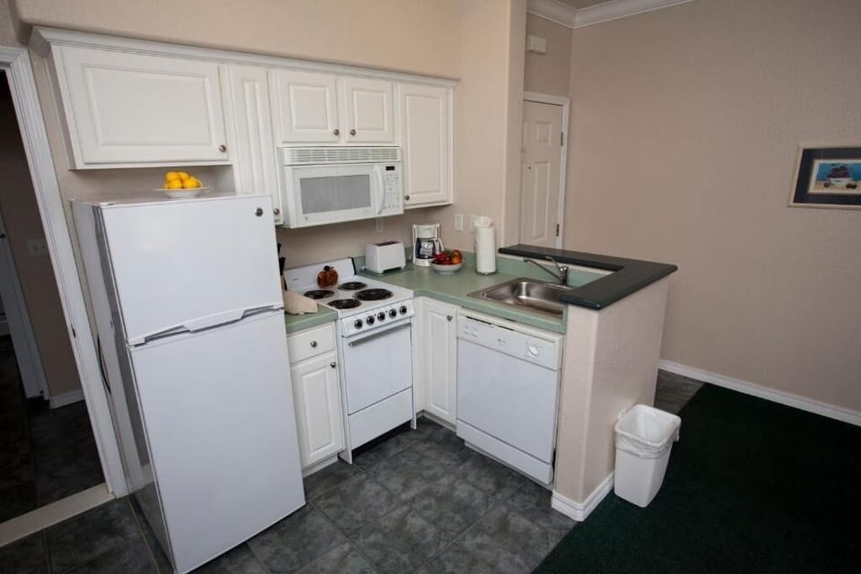 Cook quick meals in a bright, fully equipped kitchen.