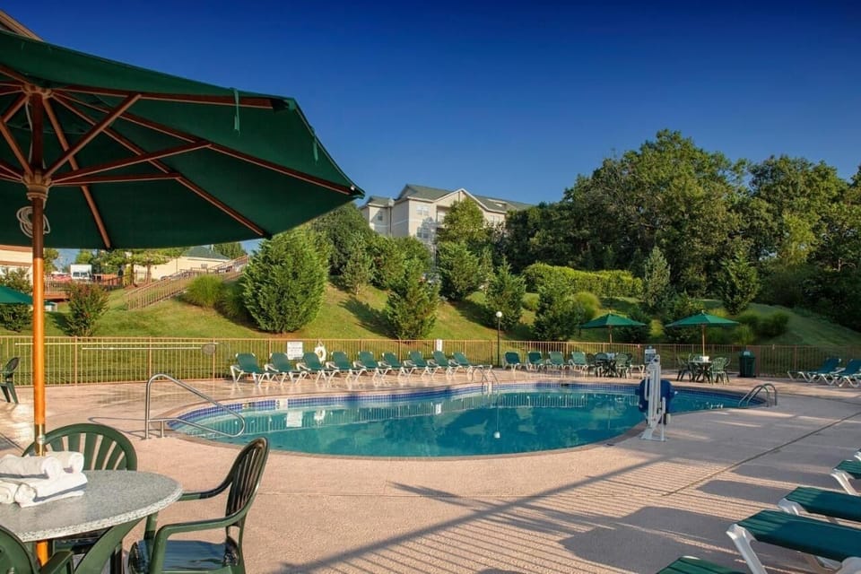 Gather with friends for relaxed poolside chats under umbrellas.